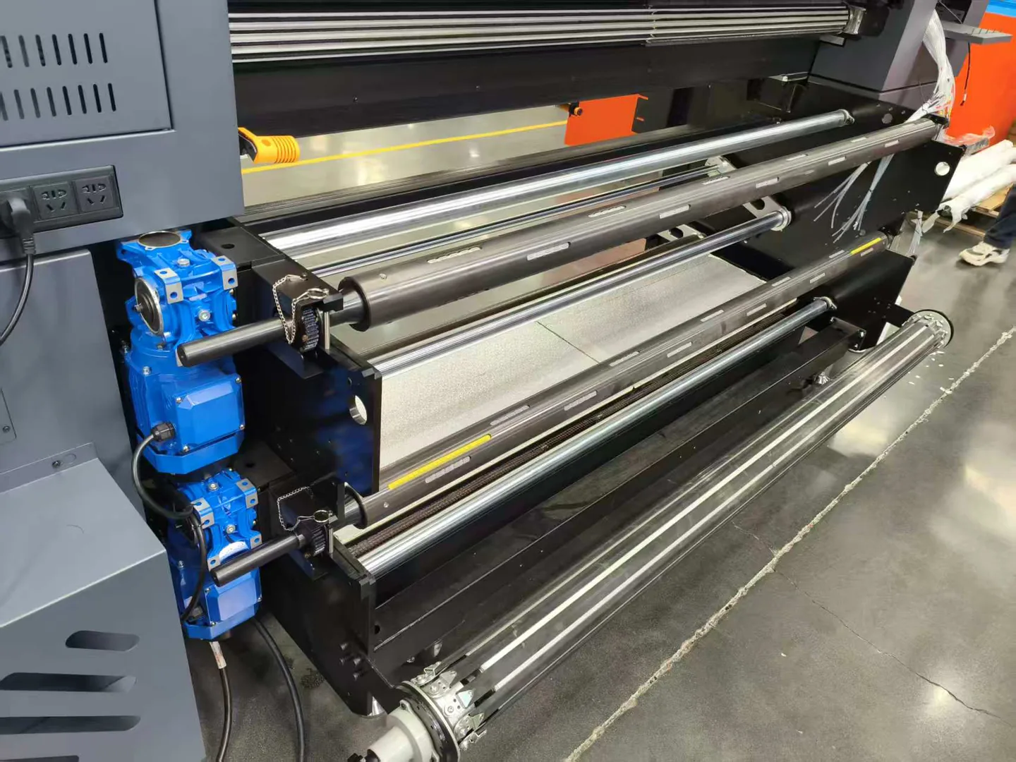 Close-up of the constant-tension feed and take-up rollers
